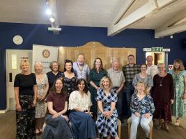 Grant recipients at the Rotary SwiMarathon presentation evening in May 2025, with president Ian Clarkson
